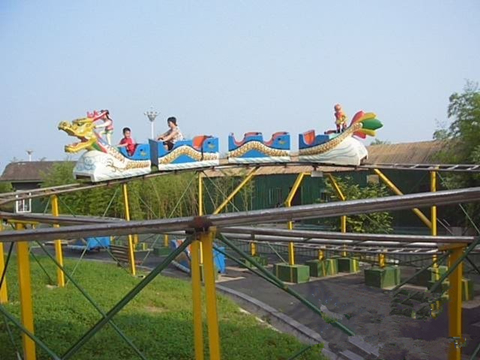 Yellow dragon roller coaster ride
